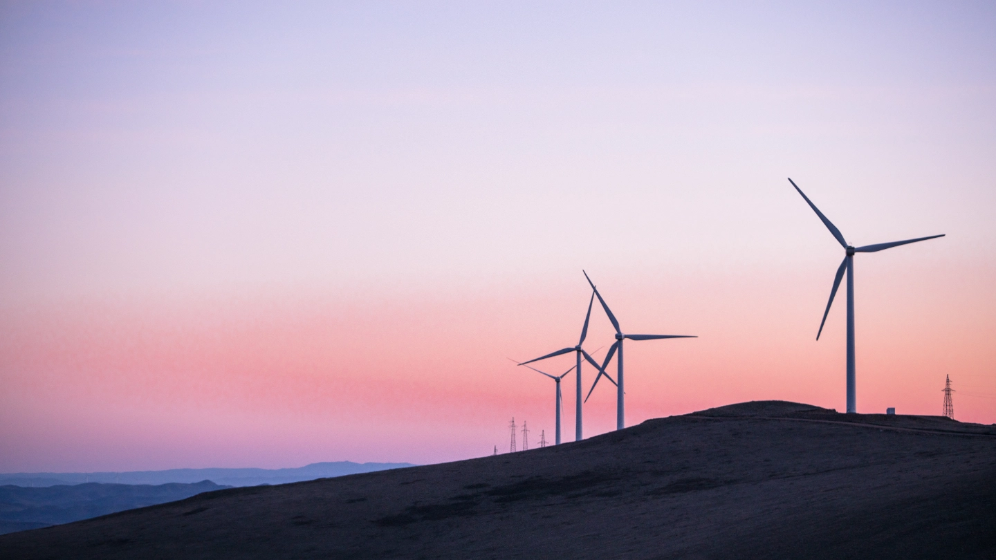 Wind turbines on a hillside at dusk Wind turbines on a hillside at dusk